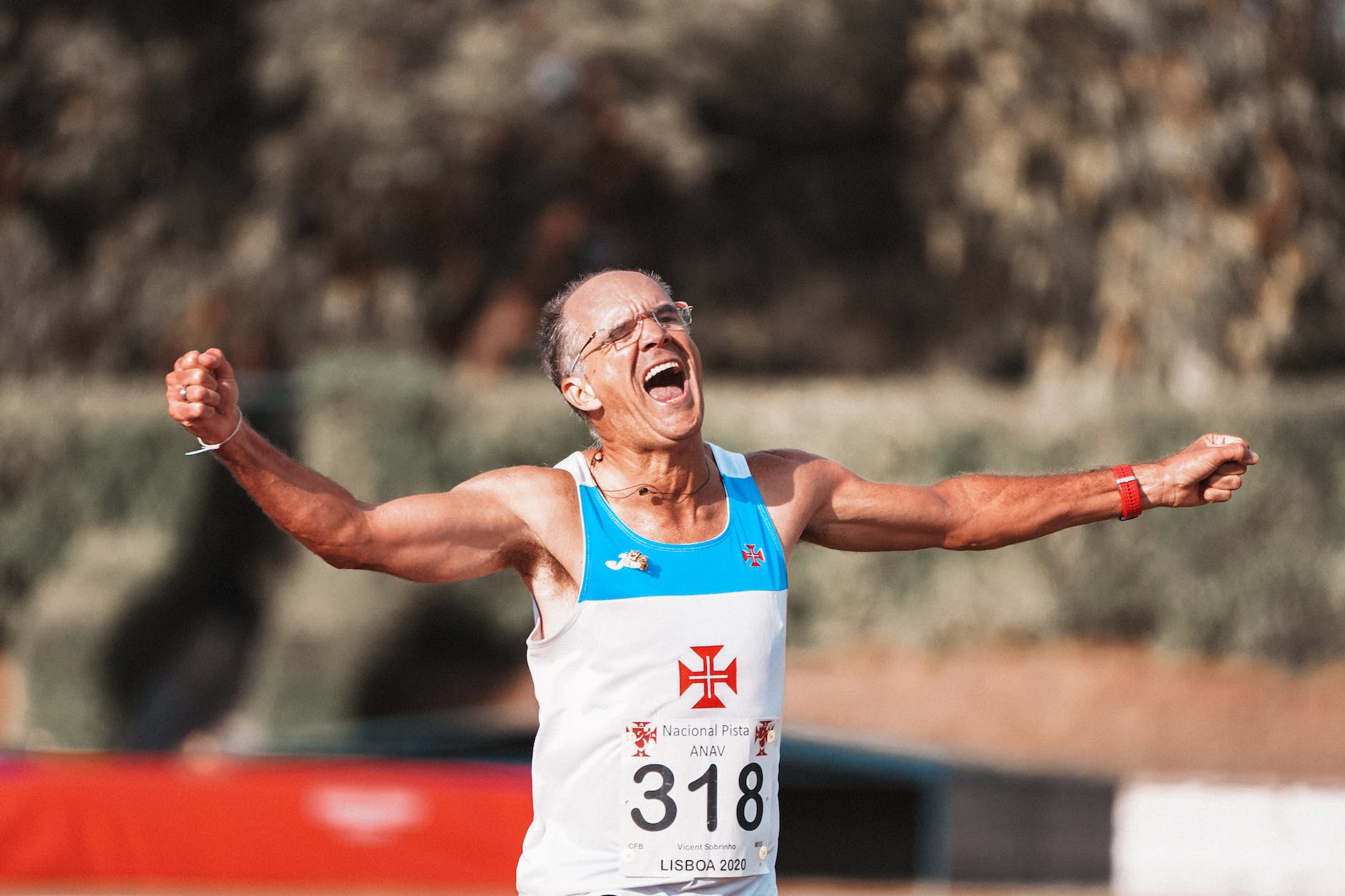 excited happy old man finishing sprint